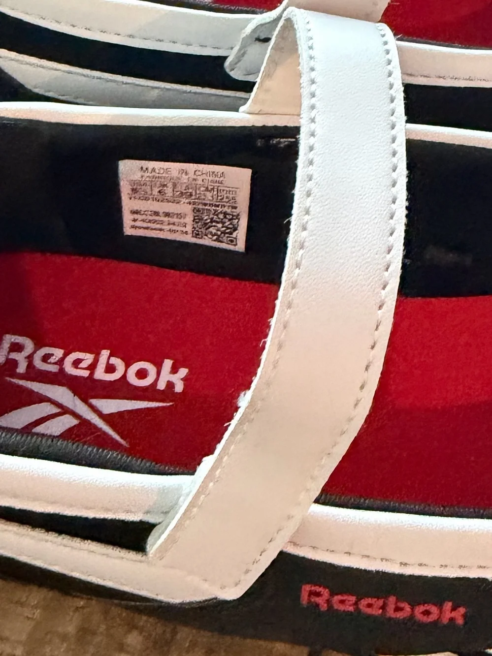 Reebok women’s Black and White Mary Jane Sneakers with Red Insole